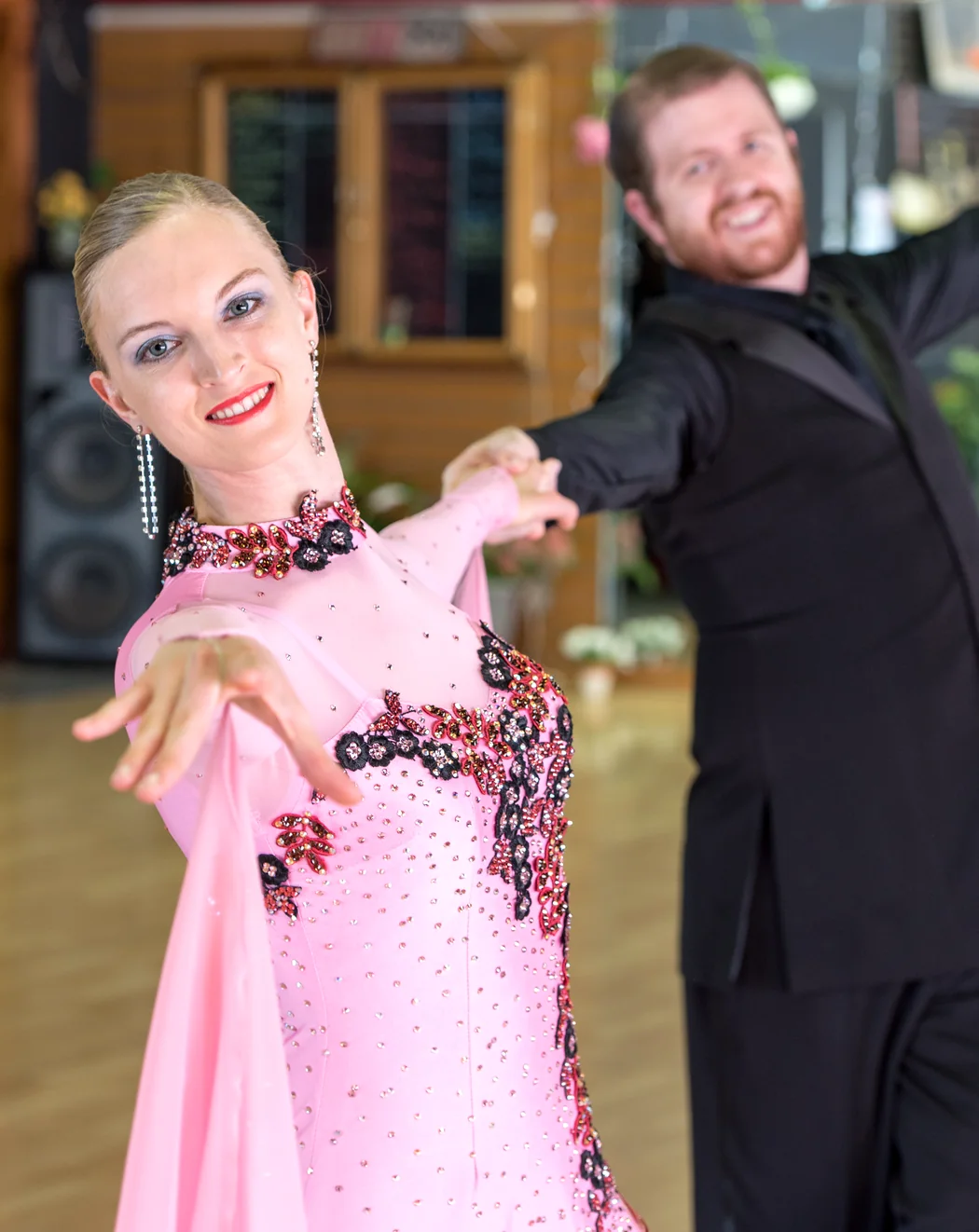 Bria and Eric Bird dancing ballroom with a connected partner frame